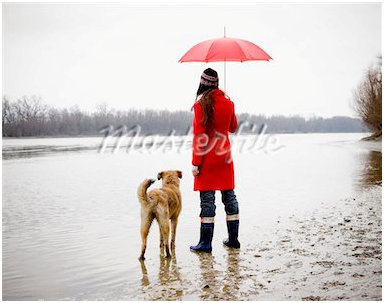 she is taking a walk with her dog